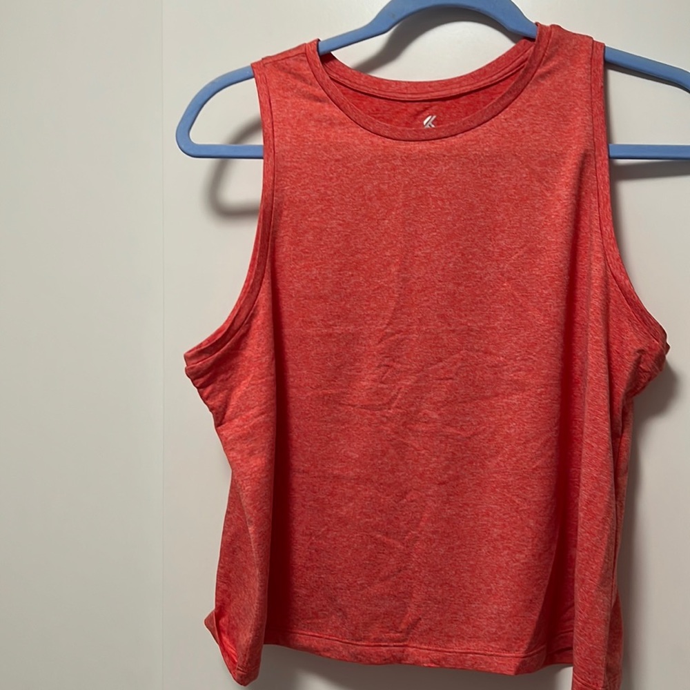 Lightly worn workout top. Dry fit material. Super good chest coverage.